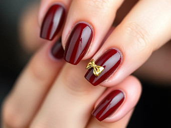 sharper shape with like a dark brown red color with a simple design that's easy for beginners some 3d builder gel art with gold chrome maybe a bow