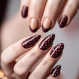 almond shape maroon nail with brown polka dots
