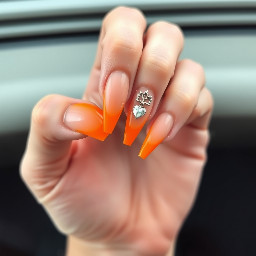 Super long 5xl nails with orange French tips and charms