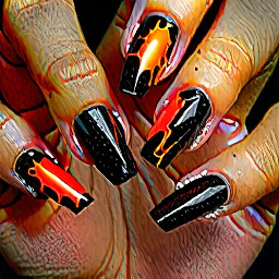 molten-lava-themed manicure. Picture glossy stiletto nails with a charred matte black base that "cracks" open to reveal a glowing, neon orange and fiery red shimmer underneath, finished with a thick 3D clear gel to mimic bubbling volcanic glass.