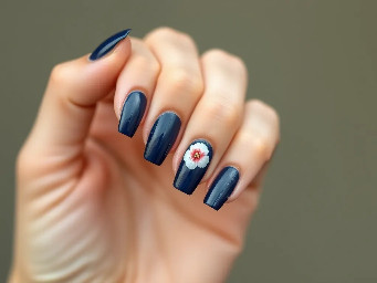navy blue bit of crome and french tips with a simple flower for summer and acrilic