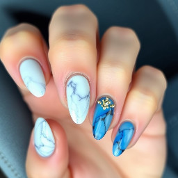 -blue cat eye color  -White color (for marble nails) -Almond shaped -Blue&gold junk nails on ring fingers -small gold rhinestones on white/blue cat eye marble nails. No rhinestones on the other nails. The marble is white with the blue One nail in each column needs to be a junk nail. No nails are just white. One nail in each column is marble and gold w/small rhinestones spotted around it