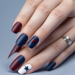 Navy nails with maroon ring finger with white star outline