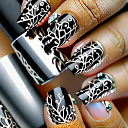 Silver chrome nails with delicate, hand-painted black vine patterns and tiny clear crystal accents, high-shine finish