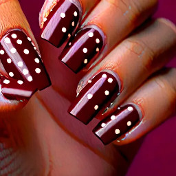 almond shape maroon nail with brown polka dots