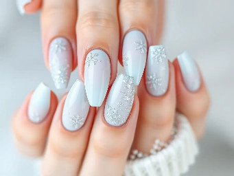 stiletto almond nails with a frosty winter and/or ice theme with the colours white and light misty blue. Can use glitter, French tips, ombre, shapes