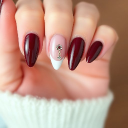I want almond-shaped burgundy nails. I want the thumb, middle, and pinky fingers to be completely burgundy, the index finger to have a burgundy French tip with a charm, and the ring finger to have 3D effec