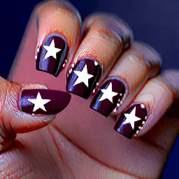 Dark burgundy nails with navy blue ring finger with white star outline