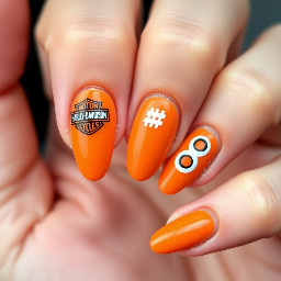Almonds shapes orange nails with a Harley Davidson logo on the thumb a hashtag on the pointer finger and an 8 on each of the other fingers