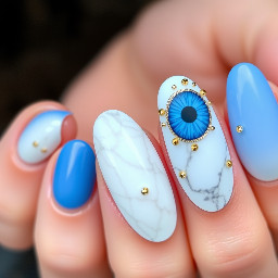 -blue cat eye color  -White color (for marble nails) -Almond shaped -Blue&gold junk nails on ring fingers -small gold rhinestones on white/blue cat eye marble nails. No rhinestones on the other nails. The marble is white with the blue One nail in each column needs to be a junk nail. No nails are just white. One nail in each column is marble and gold w/small rhinestones spotted around it