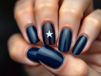 Navy nails with maroon ring finger with white star outline