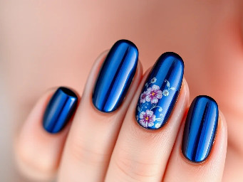 Dark blue chrome almond nails with some simple floral design
