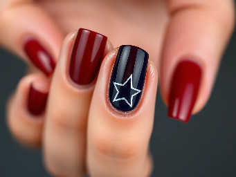 Dark red nails with navy blue ring finger with white star outline