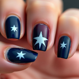 Navy nails with maroon ring finger with white star outline
