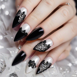 Thumb: Long stiletto shape with a pearlescent white/silver cat-eye base. The French tip features a black lace pattern with floral and fishnet details, outlined in black and accented with small sparkles/rhinestones along the French boundary line.   Index Finger: Pearl cat-eye base with a deep French tip. The tip is filled with black lace floral linework, outlined in black with a small central rhinestone accent where the French line peaks.   Middle Finger: Pearly shimmer base with a French tip featuring detailed black lace patterns and delicate rhinestone embellishments near the smile line.   Ring Finger: black background, "it girl" written sideways on white and cursive Little Finger (Pinky): Pearl cat-eye base with a crisp black lace French tip pattern and tiny rhinestones detailing the inner edge.
