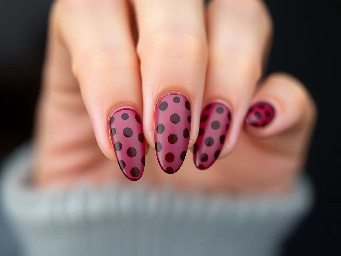 almond shape maroon nail with dark brown polka dots