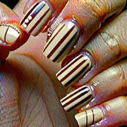 short alomnd shape nails. thumb is light beige with thin brown vertical stripes, pointer finger is a french tip with the same light beige and brown small polka dots, middle finger is light beige with big brown polka dots, ring finger is light beige with thin brown vertical stripes, and little finger is french tip light beige and small dark brown polka dots