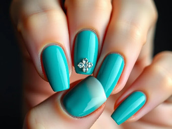 teal nails with a white one on the ring finger nail