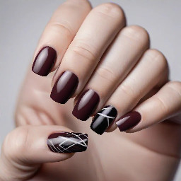 marron nails that say luray in marroon whit and black