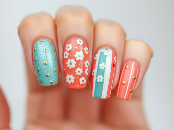 Thumb: Plain, solid no. design teal shimmer Pointer Finger: A soft, licoral base completely covered in tiny gold and teal hearts.Middle Finger: A lighter shimmery teal base decorated strictly with clean white daisies—no leaves or greenery.Ring Finger: A solid, full coat of smooth, metallic soft gold.Pinky Finger: A soft, coral base detailed with crisp vertical stripes and a couple of tiny scattered hearts .ring finger is a soft gold, pointer finger coral with. teal and gold .tiny hearts pinky is coral stripes bu als has s couple tiny heartsin gold an teal.
