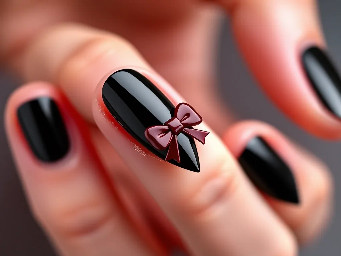 black stiletto french tip nails with a wine red bow and wine red outline