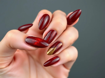 sharper almond shape with like a dark brown red color with a simple design that's easy for beginners maybe some 3d gel art with gold chrome