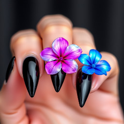 Stiletto black nails with purple iridescent flower , pink iridescent flower, blue iridescent flower