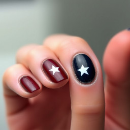 Burgundy nails with navy blue ring finger with white star outline