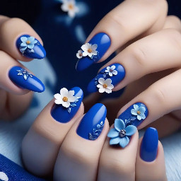 A deep royal blue and baby blue nails with 3d flowers and exotic nail art